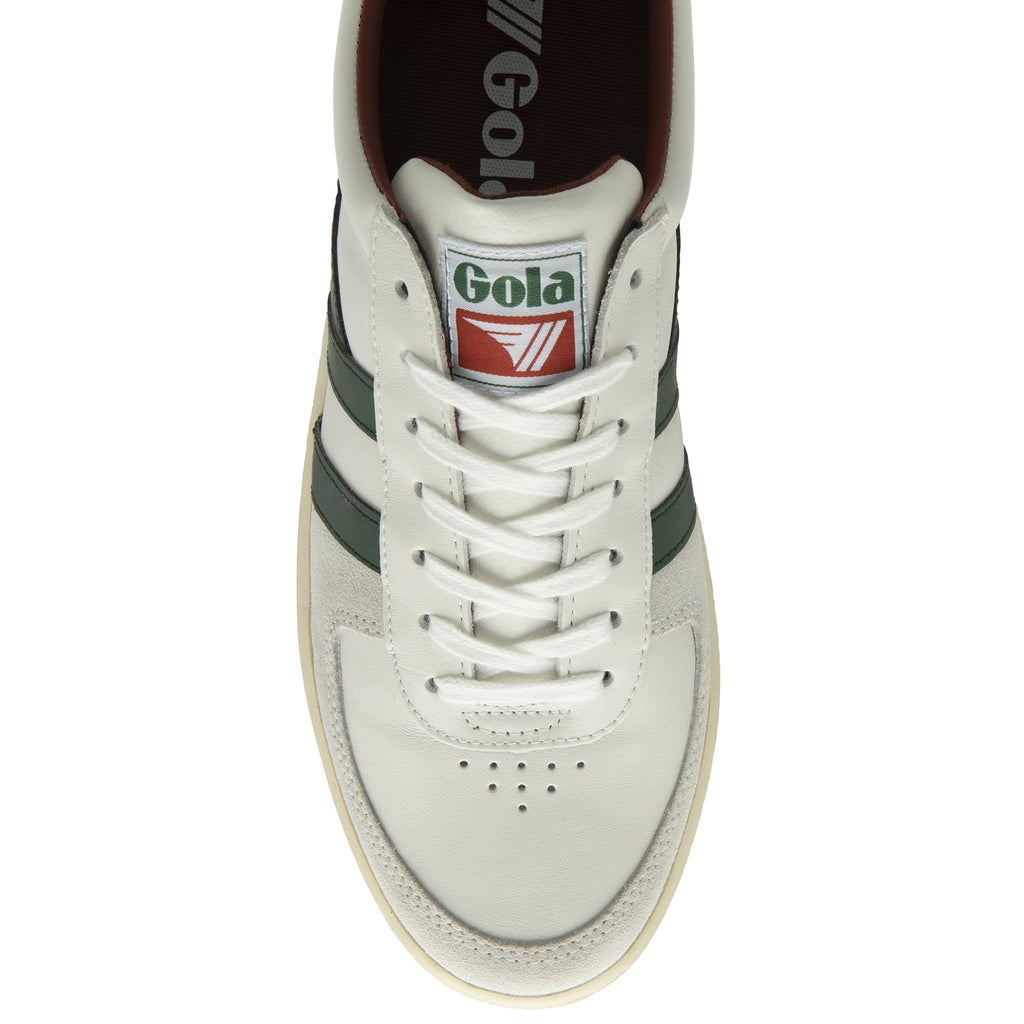 A top-down view of a white and green Gola sneaker with brown accents.