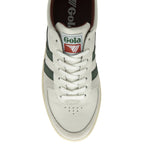 A top-down view of a white and green Gola sneaker with brown accents.