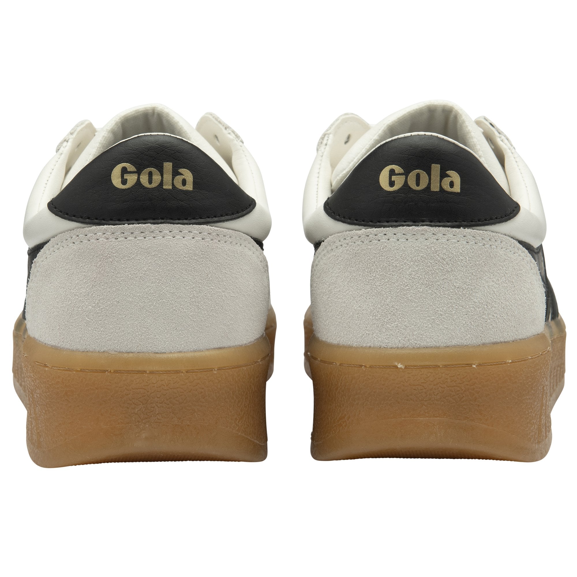 A pair of white Gola sneakers with black and gold accents on the back.
