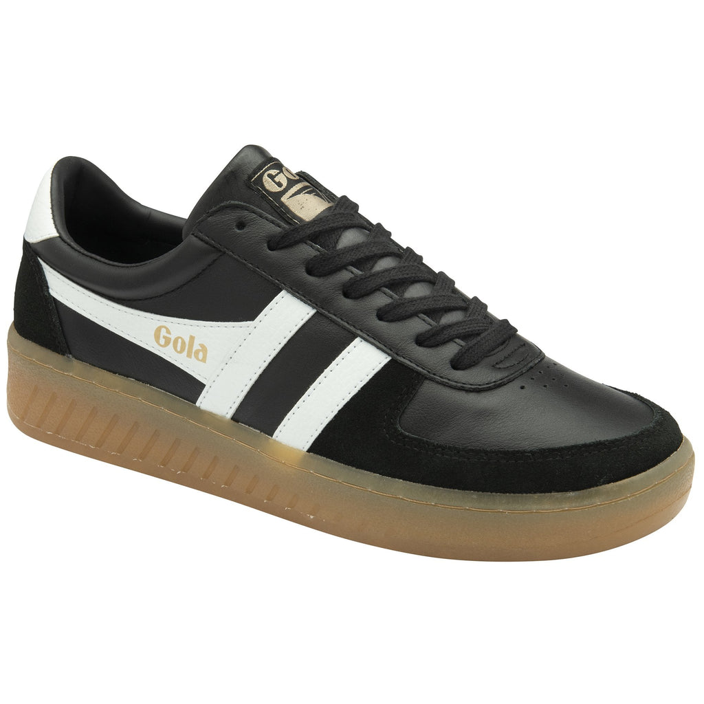 Black Gola sneaker with white stripes and a gum sole, viewed from an angle.
