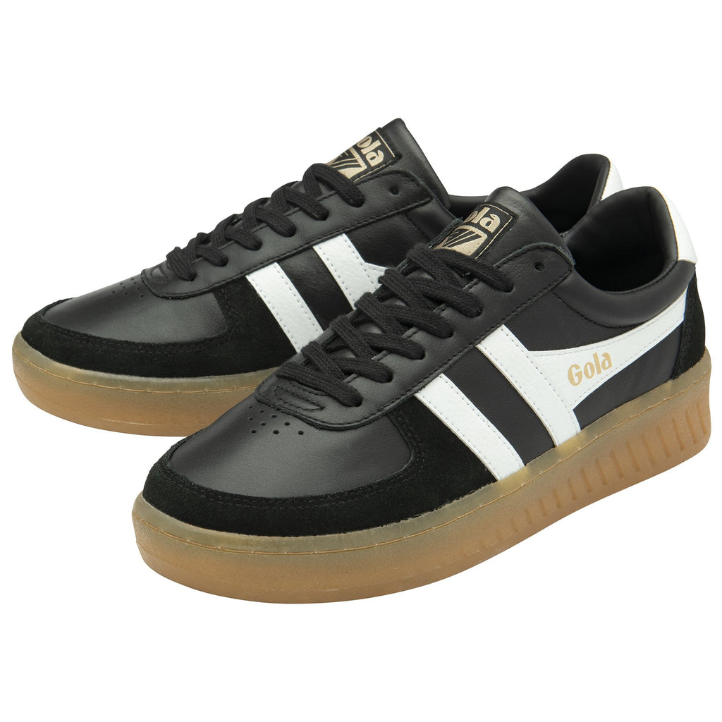 Pair of black Gola sneakers with white stripes and gum soles, angled together.