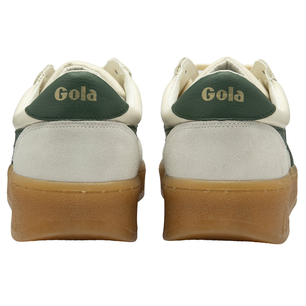 Rear view of two white Gola sneakers with green heel accents and brown soles.