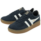 A pair of men's trainers with navy blue suede uppers and white accents.