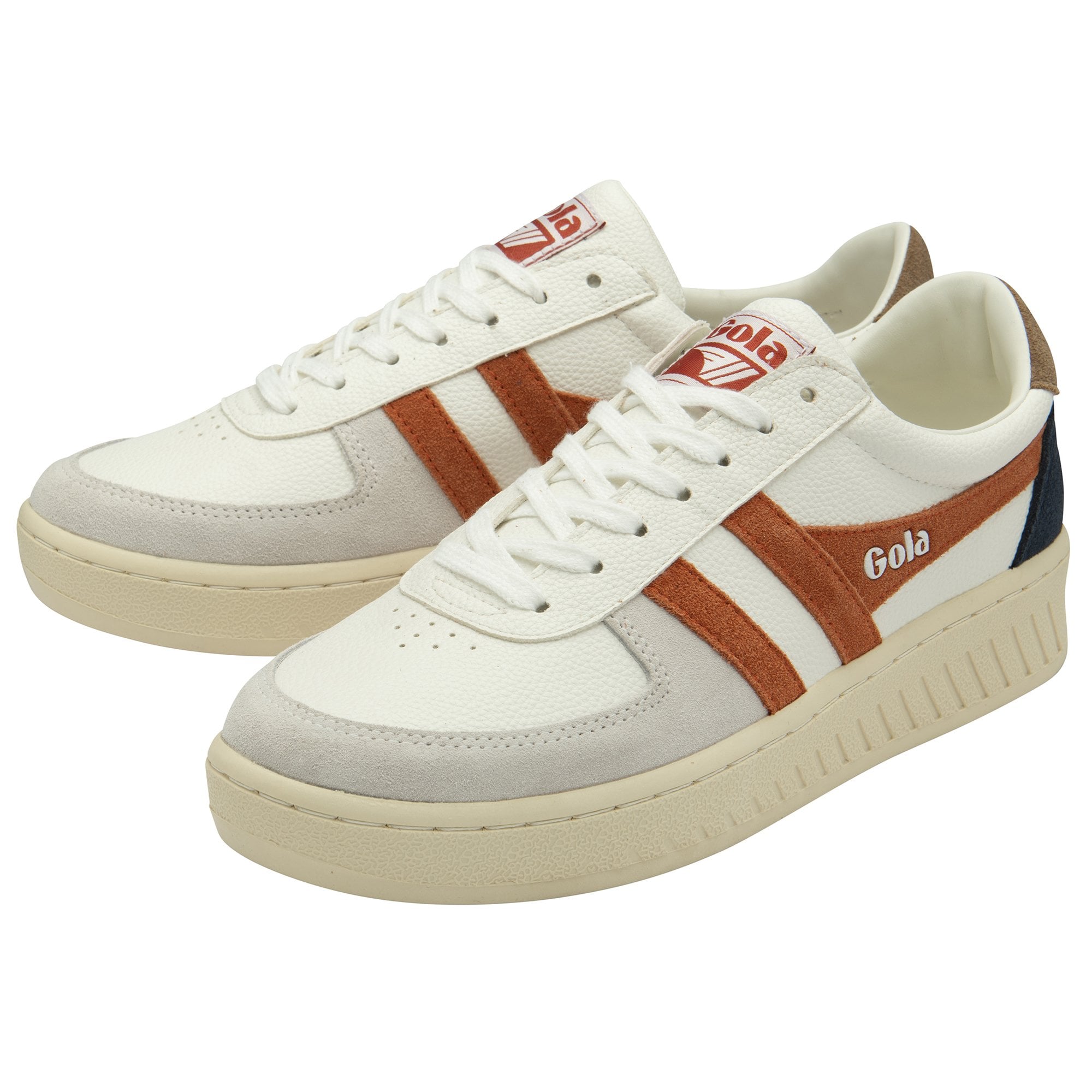 A pair of recycled men's trainers with white uppers and subtle orange accents.