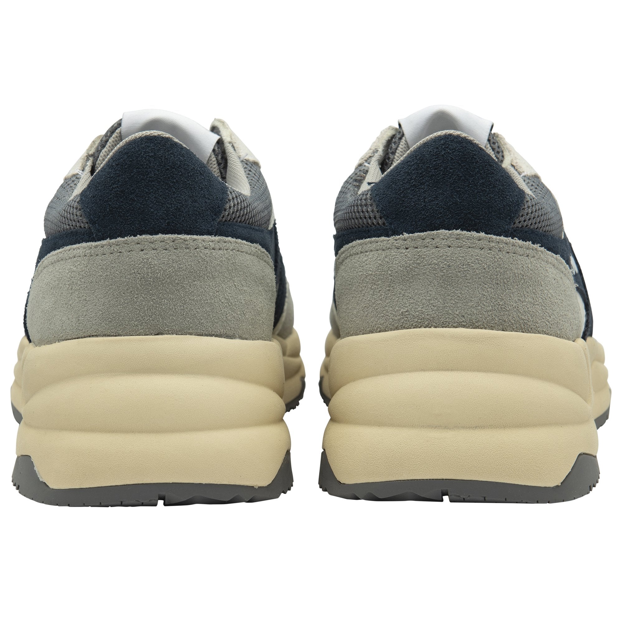 Rear view of two men's trainers with white and navy blue accents.