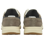 Rear view of two recycled men's trainers with white and blue accents.