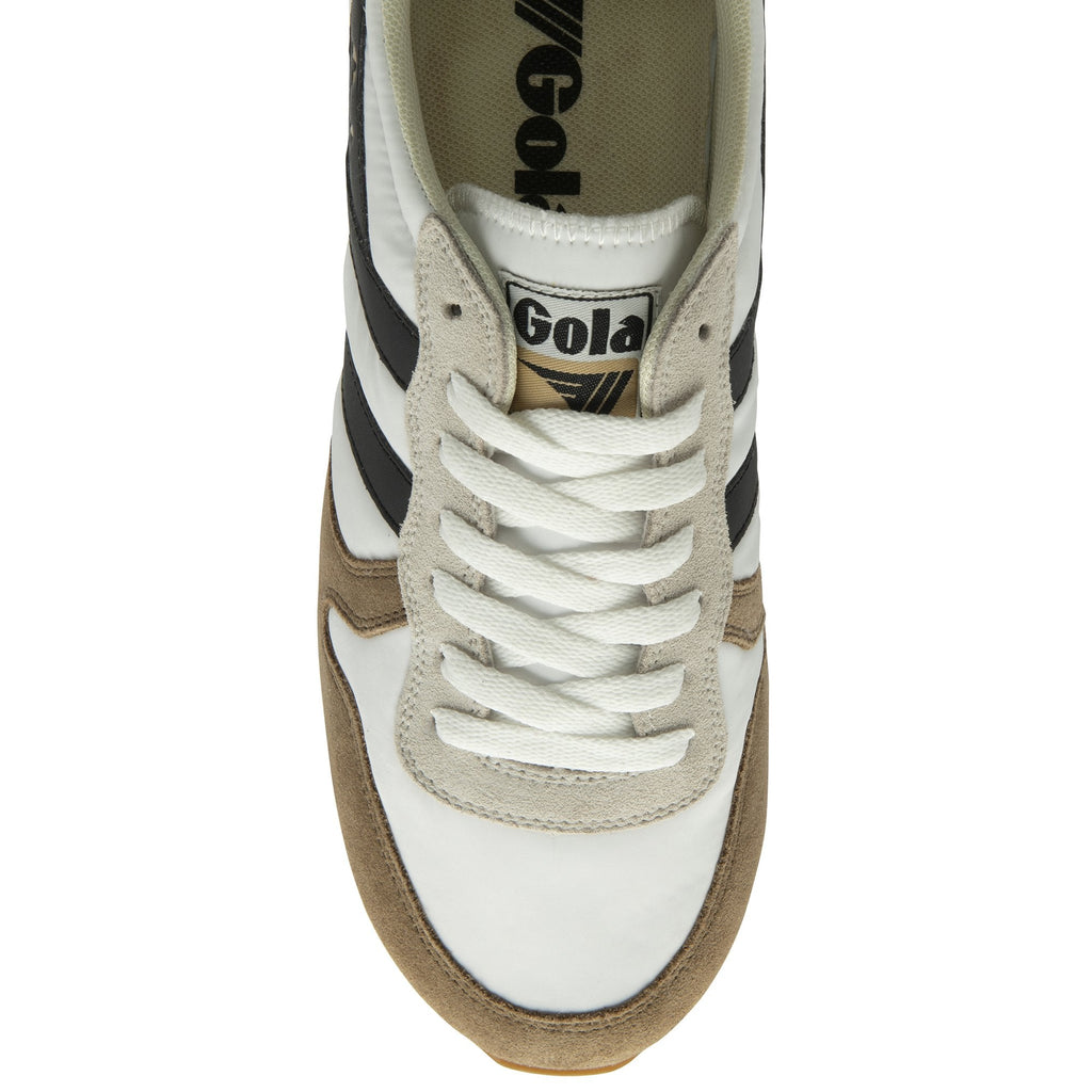 The top-down view of a white and brown Gola sneaker with black stripes and white laces.