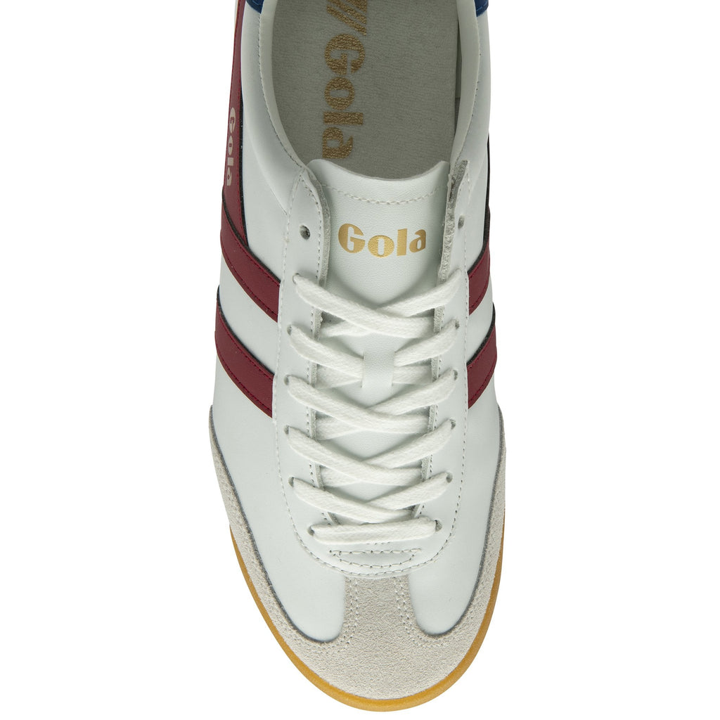 Top-down view of a white Gola sneaker with red stripes and white laces.