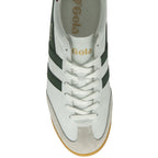 Top-down view of a white Gola sneaker with green stripes and white laces.