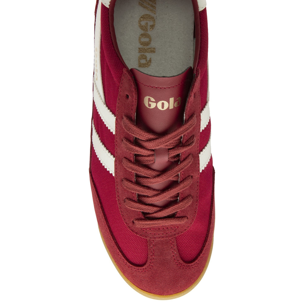 Top-down view of a single Gola Harrier trainer in red with white stripes and gum sole.