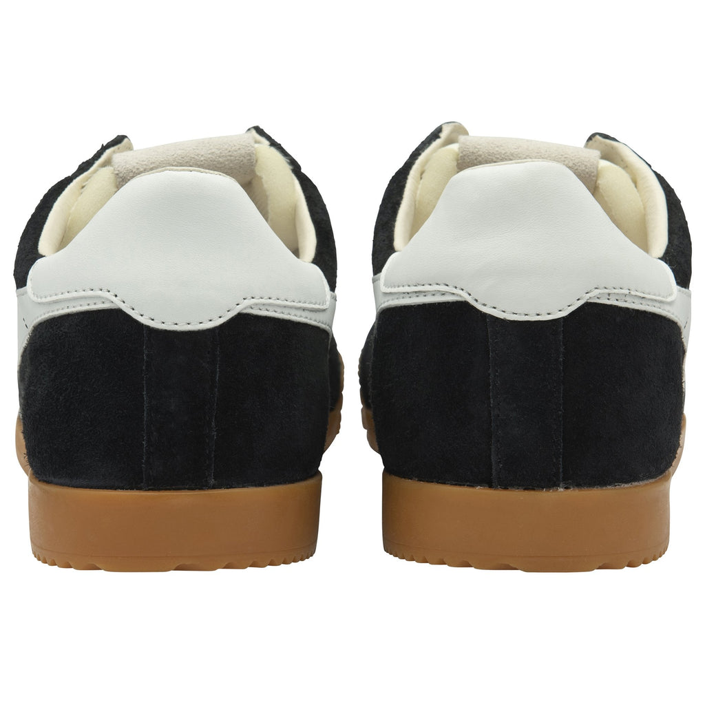 The back view of a pair of black Gola men's sneakers with white heels and gum soles.
