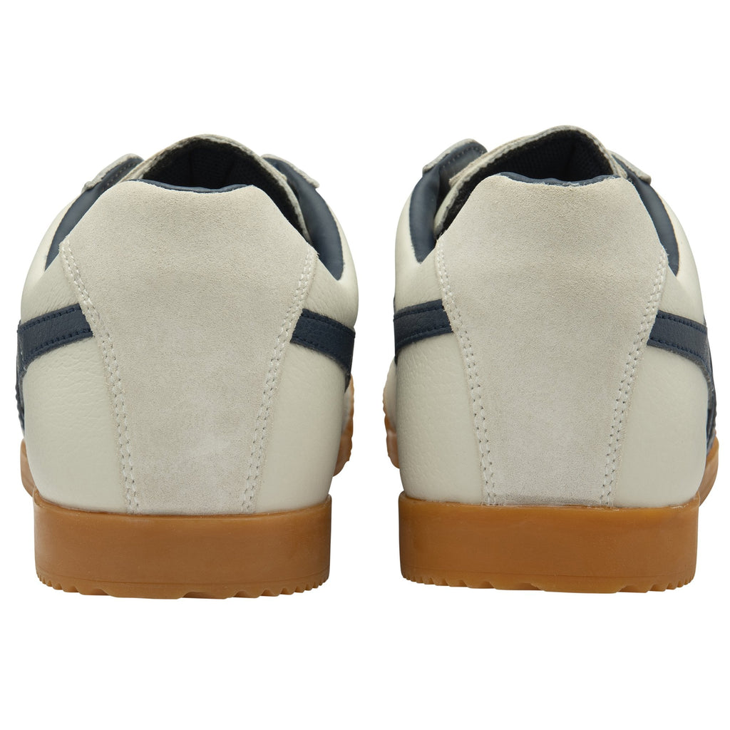 Rear view of two white and navy Gola sneakers with gum soles.