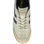 Top-down view of a white and navy Gola sneaker with a gum sole.