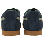 A pair of Gola Daytona trainers in navy blue with cream stripes from the back.