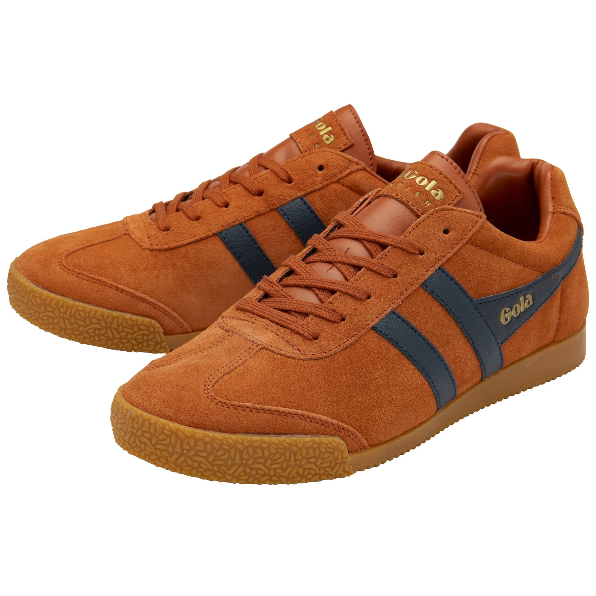 Pair of Gola Harrier suede sneakers in tan with navy blue stripes, angled view.