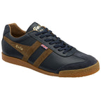 A single men's Gola Harrier trainer, navy leather with brown suede stripes, on a white background.
