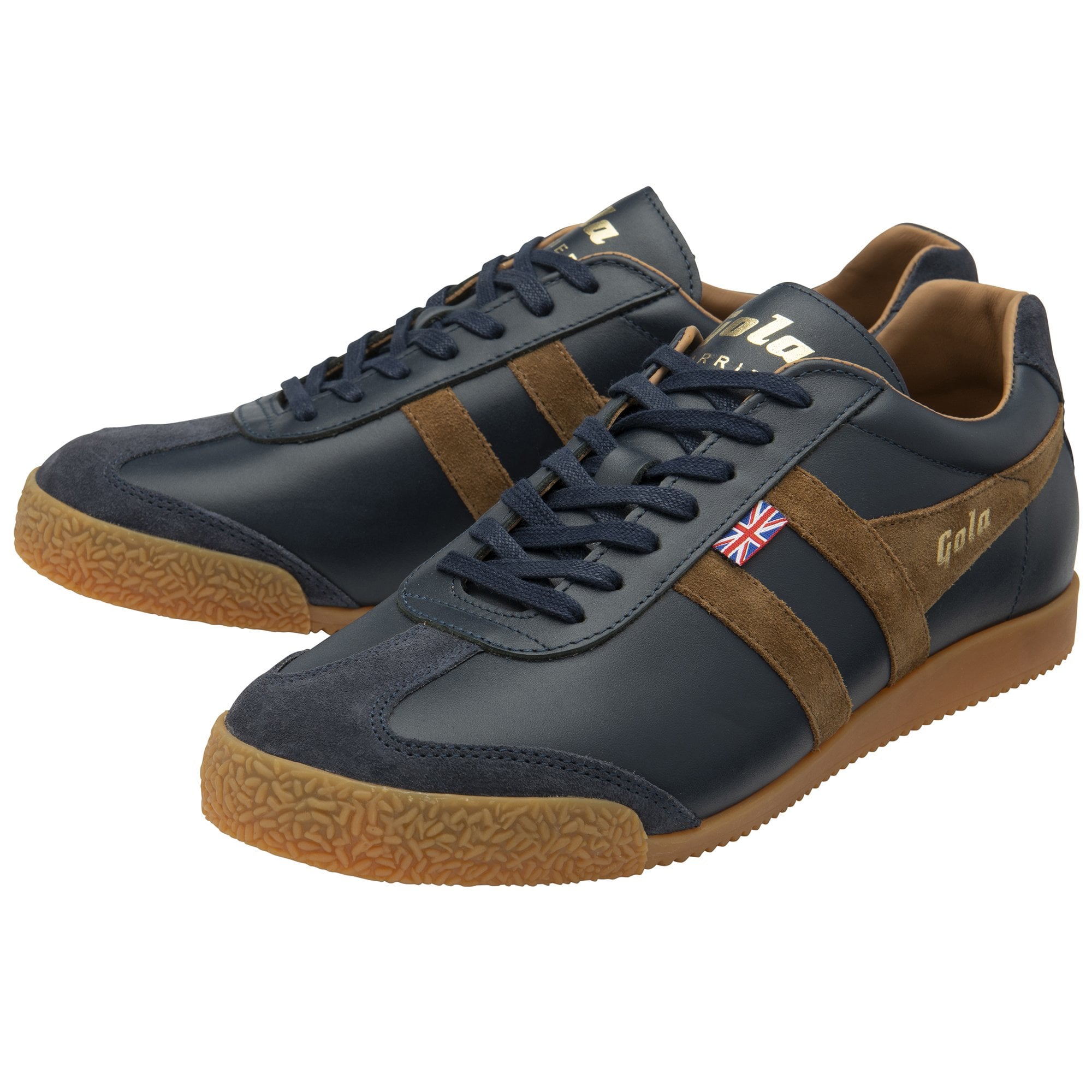 A pair of men's Gola Harrier trainers, navy leather with brown suede stripes, on a white background.