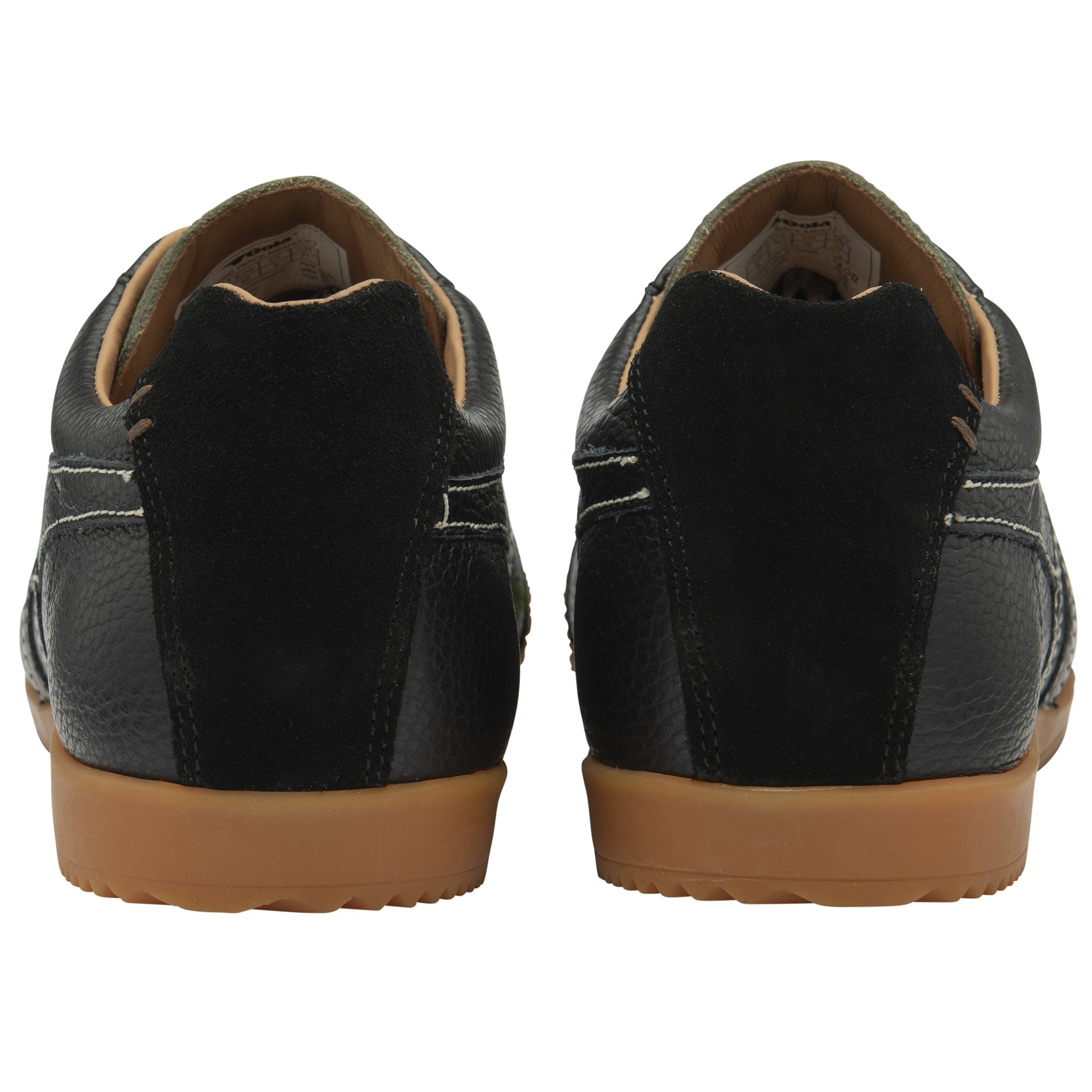 A pair of Gola low-top trainers in black with gum soles, viewed from the rear.