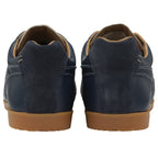 A rear view of a pair of Gola men's Harrier 72 trainers in navy with a light gum sole.