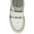 A close up of the top of a white Gola sneaker with purple stripes.