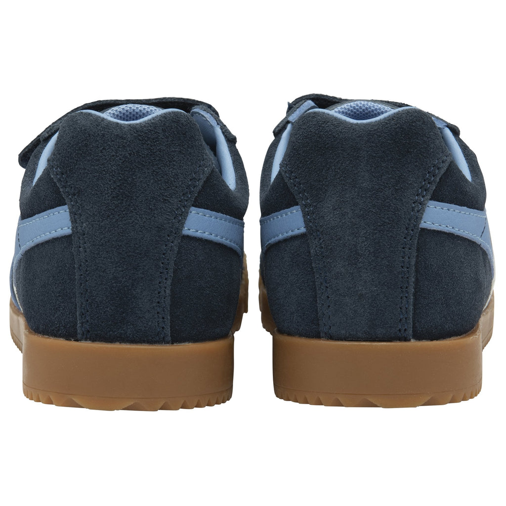 The back of two blue shoes with a light blue stripe.