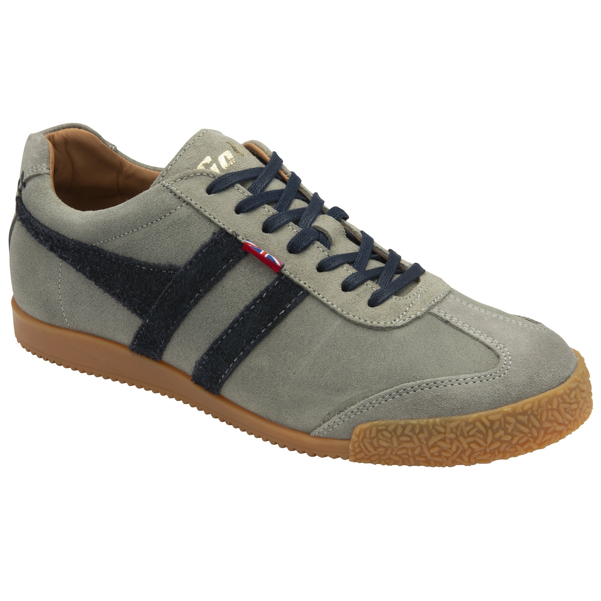 A left light gray sneaker with dark blue stripes and laces, and a brown sole.