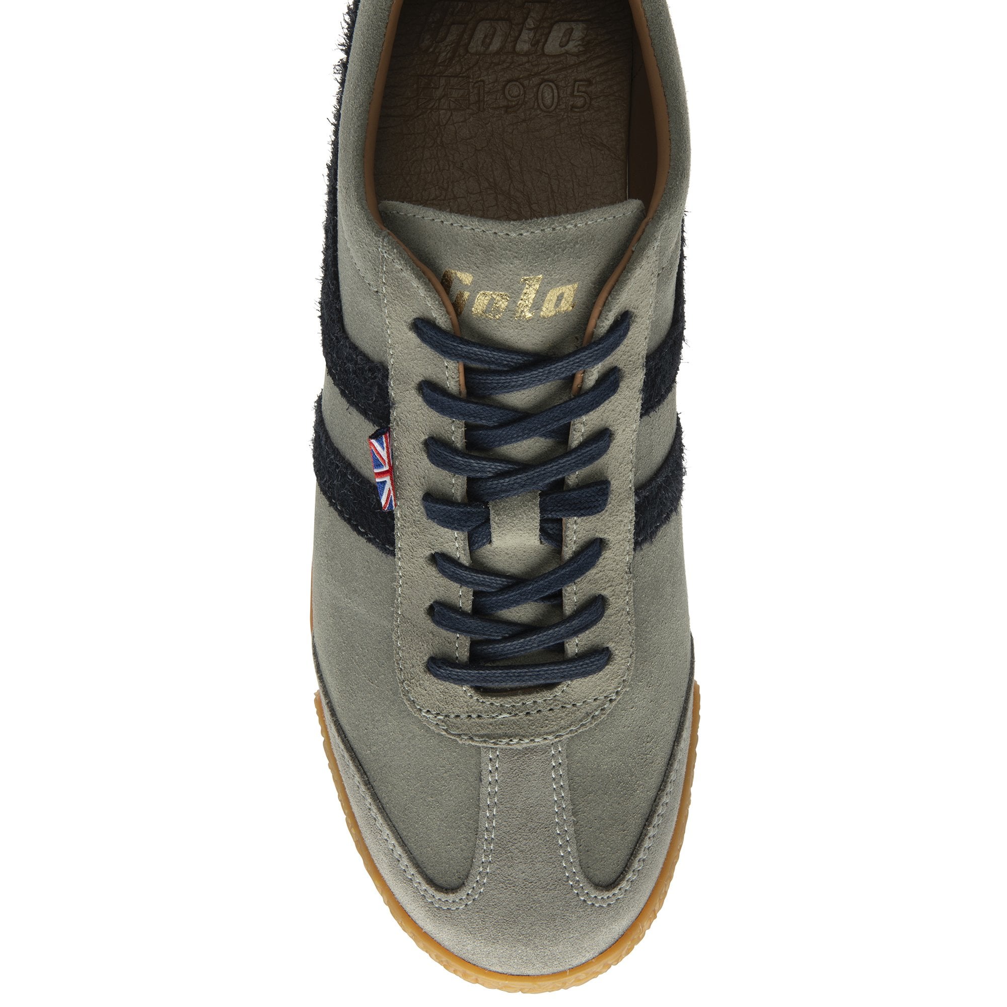 A top-down view of a light gray sneaker with dark blue stripes and laces.
