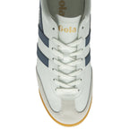 A top-down view of a white Gola sneaker with blue stripes and white laces.