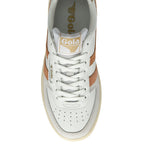 The top of a white and gold sneaker with a white midsole and a brown outsole.