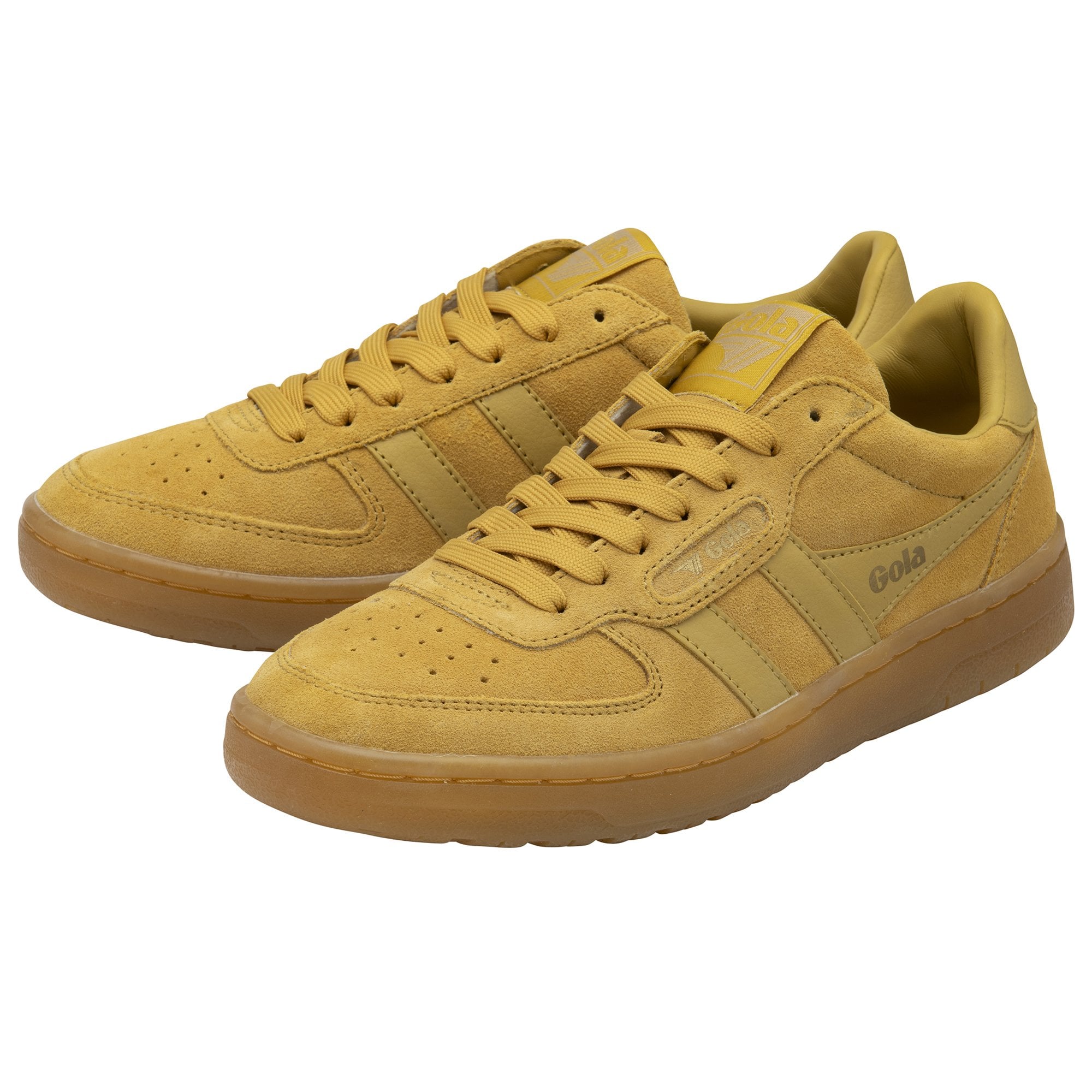 A pair of mustard yellow Gola trainers with gum soles, viewed from the side.