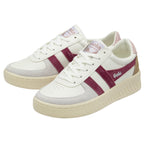 A pair of white Gola sneakers with burgundy stripes and tan heel accents.