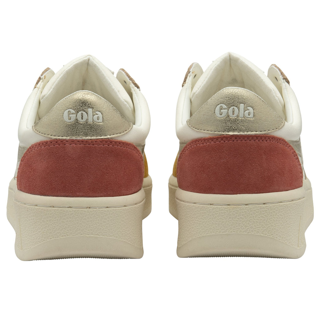 The back of a pair of white Gola sneakers with red accents and gold Gola logo on a white background.
