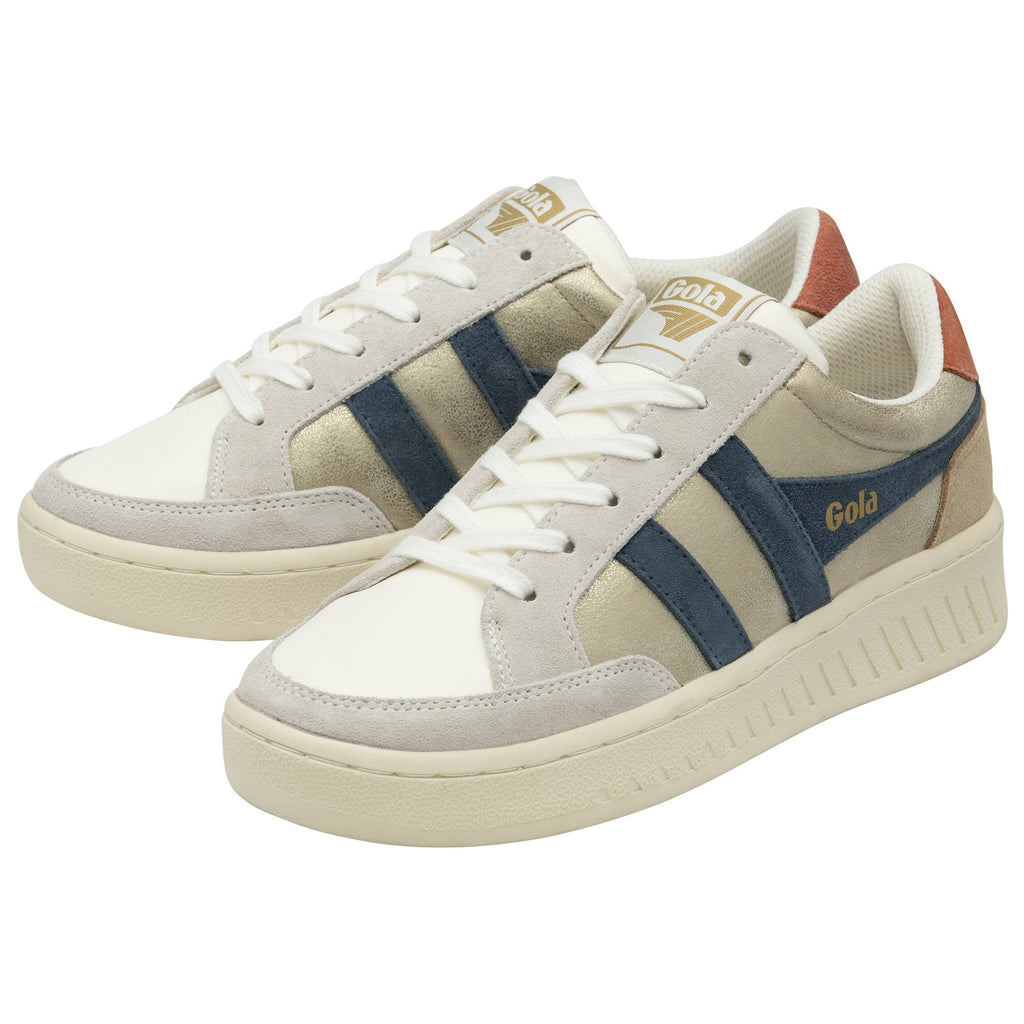 Two Gola shoes with white laces. They are white, cream, and beige with blue stripes.