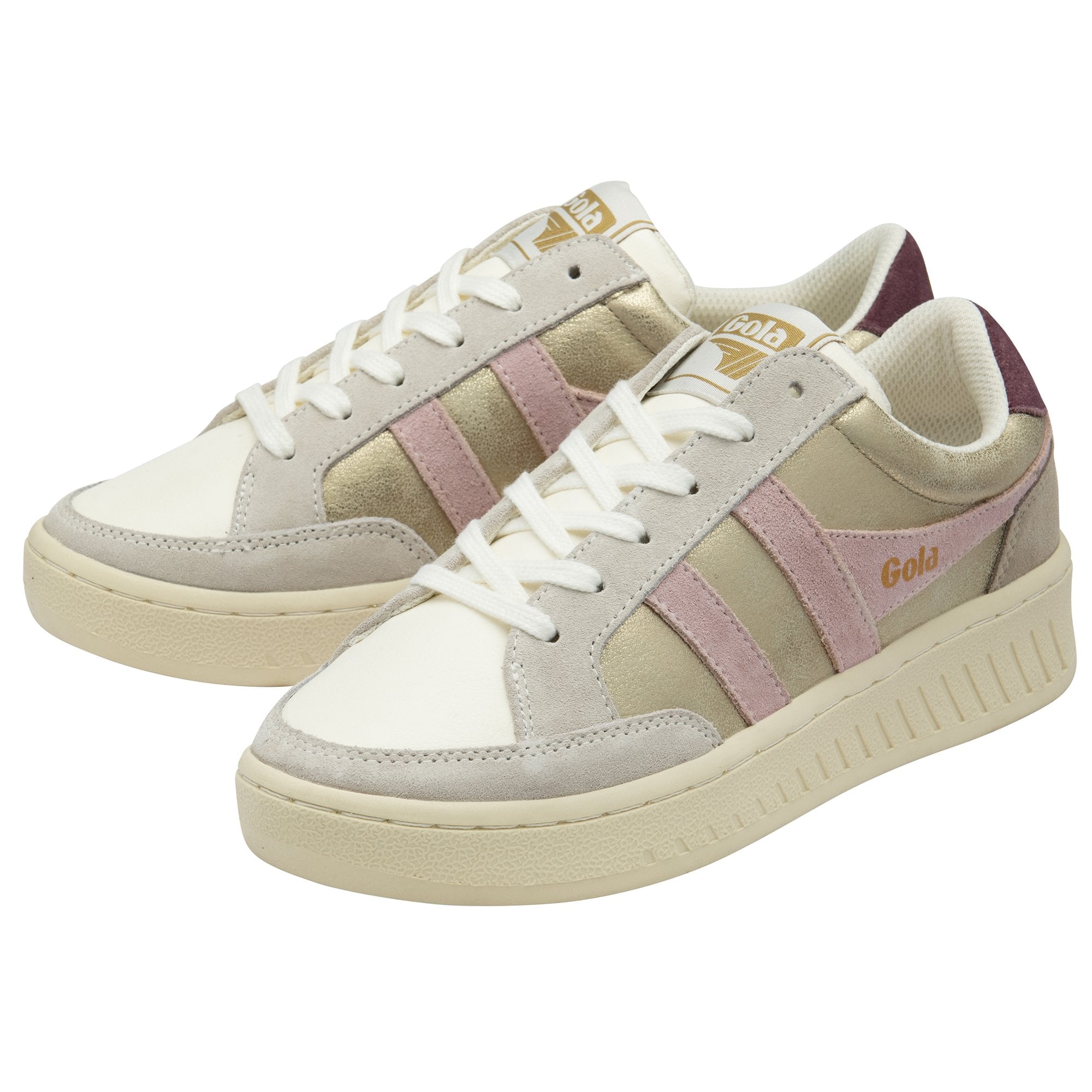 A pair of Gola low-top sneakers in gold, white, and pink, angled to the left.