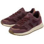 An eye-level shot of a pair of Gola shoes in red, positioned in a V-shape.