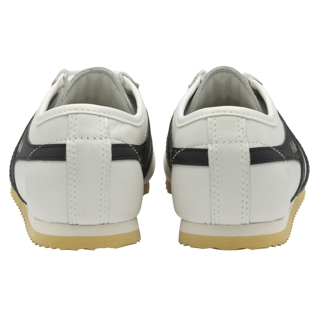 The back view of a pair of white Gola sneakers with black stripes on the sides.