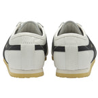 The back view of a pair of white Gola sneakers with black stripes on the sides.