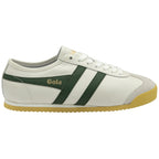 A white and green Gola sneaker with a yellow sole, side view.