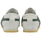 A pair of white and green Gola sneakers with yellow soles, back view.
