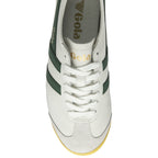 A white and green Gola sneaker with a yellow sole, top down view.
