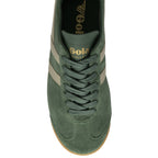 Top-down view of a single green Gola Harrier Trainer with beige stripes.