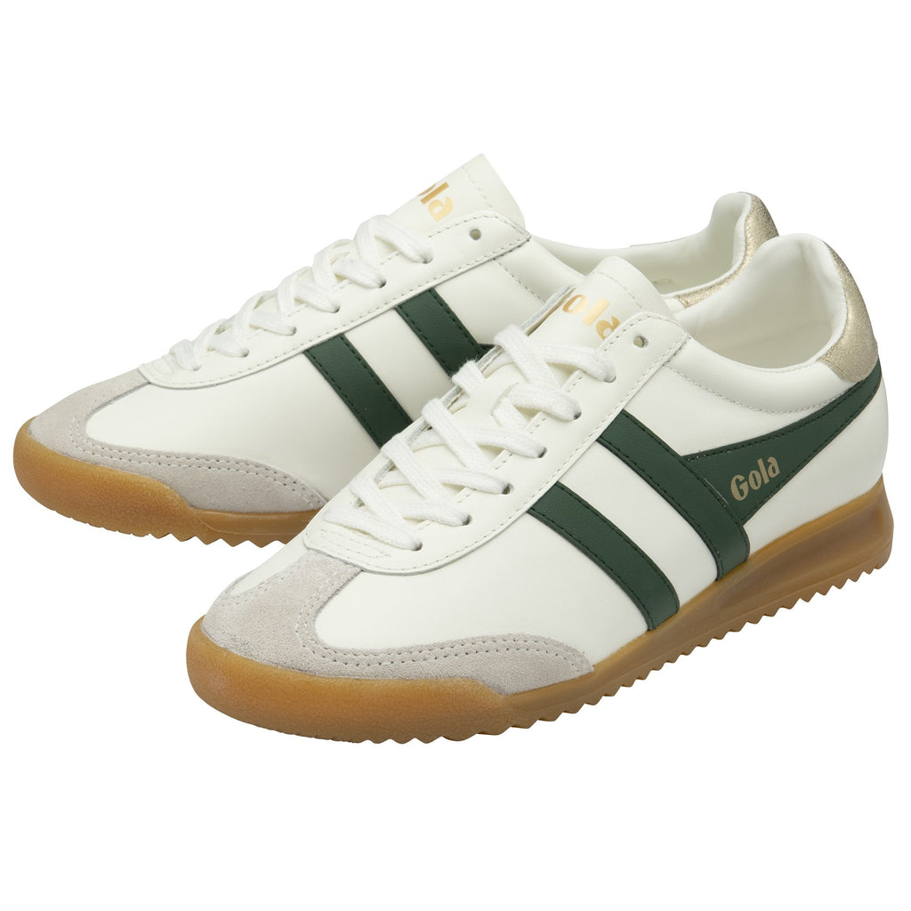 A pair of Gola Elan trainers in off-white, green, and gold with gum soles.