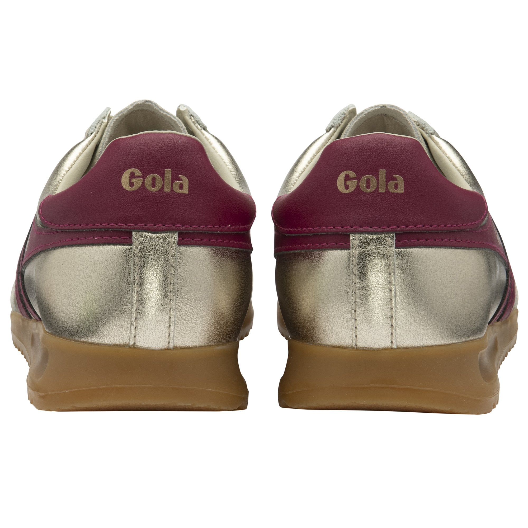 The back view of a pair of golden Gola sneakers with burgundy heel tabs.