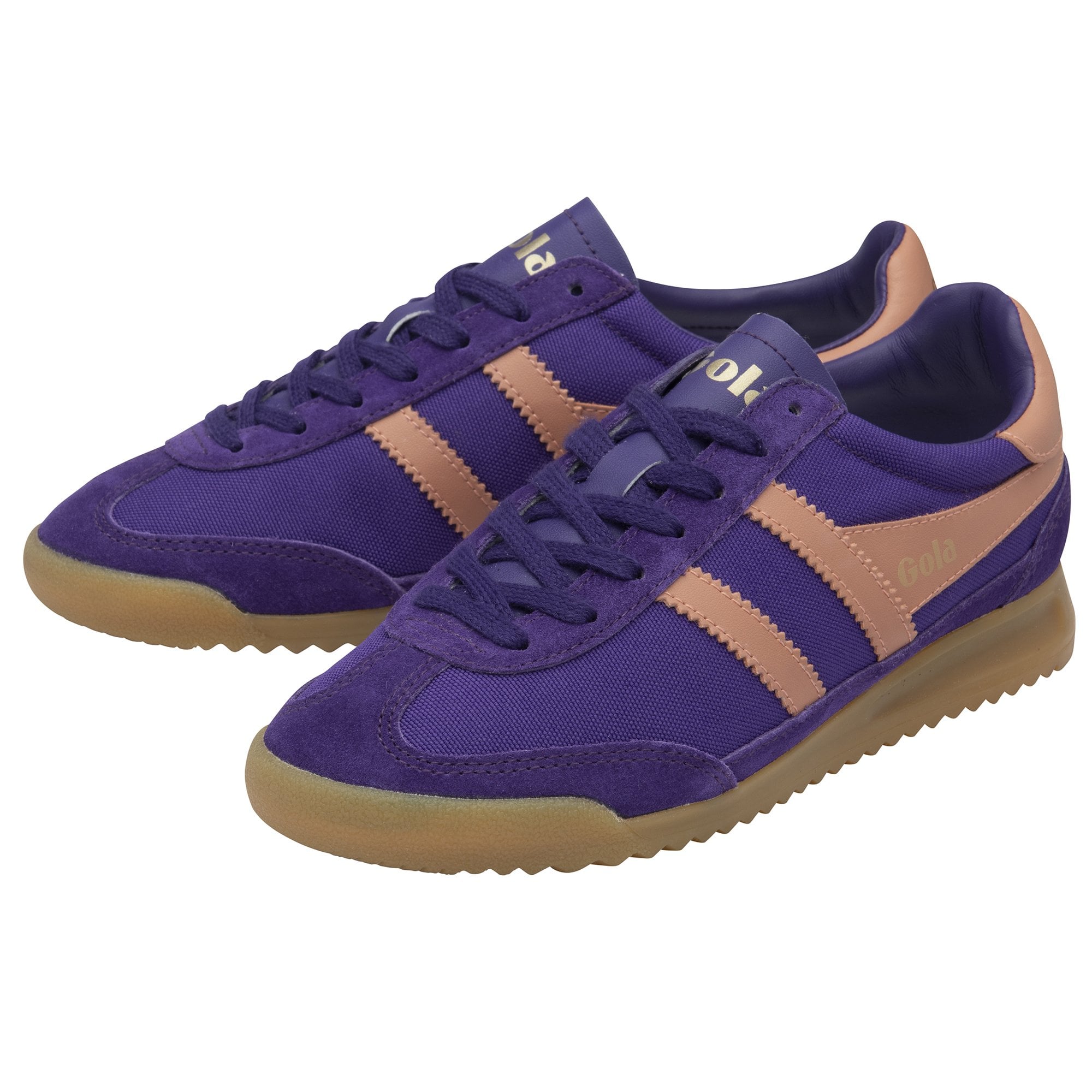 A pair of Gola Hurricane trainers in purple and tan, viewed from the side.