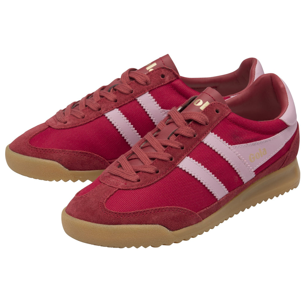 A pair of red and pink Gola trainers with tan soles, viewed from the side.
