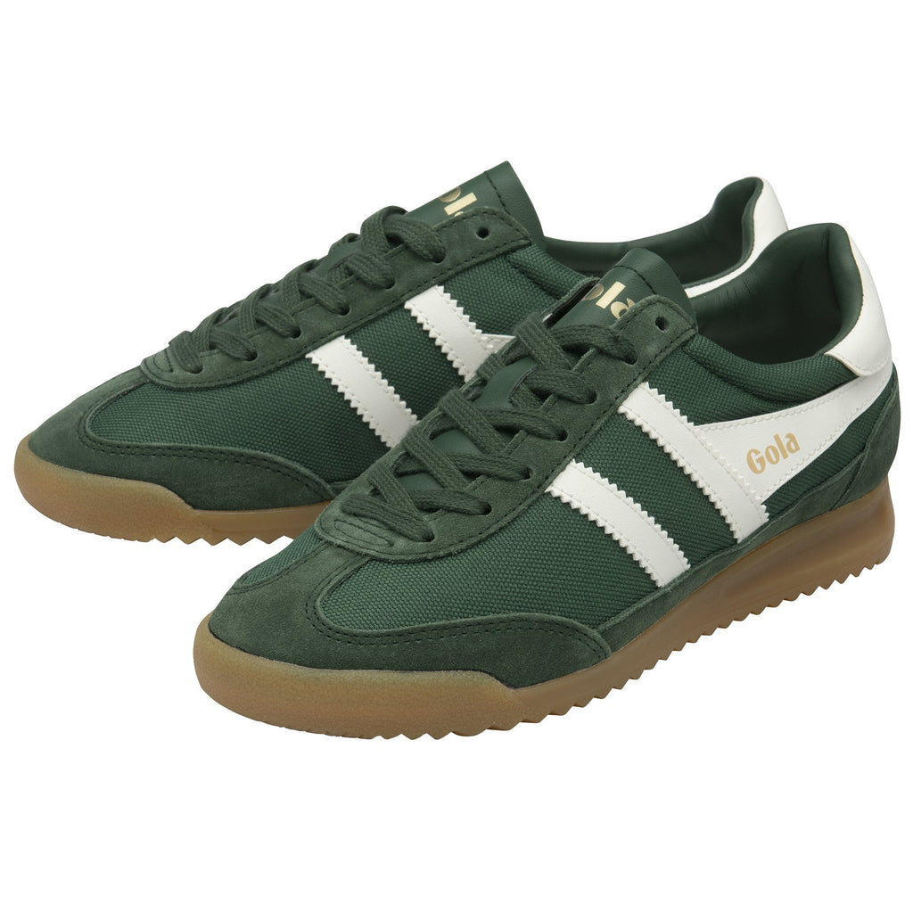 A pair of green and white Gola trainers with brown soles, viewed from an angle.