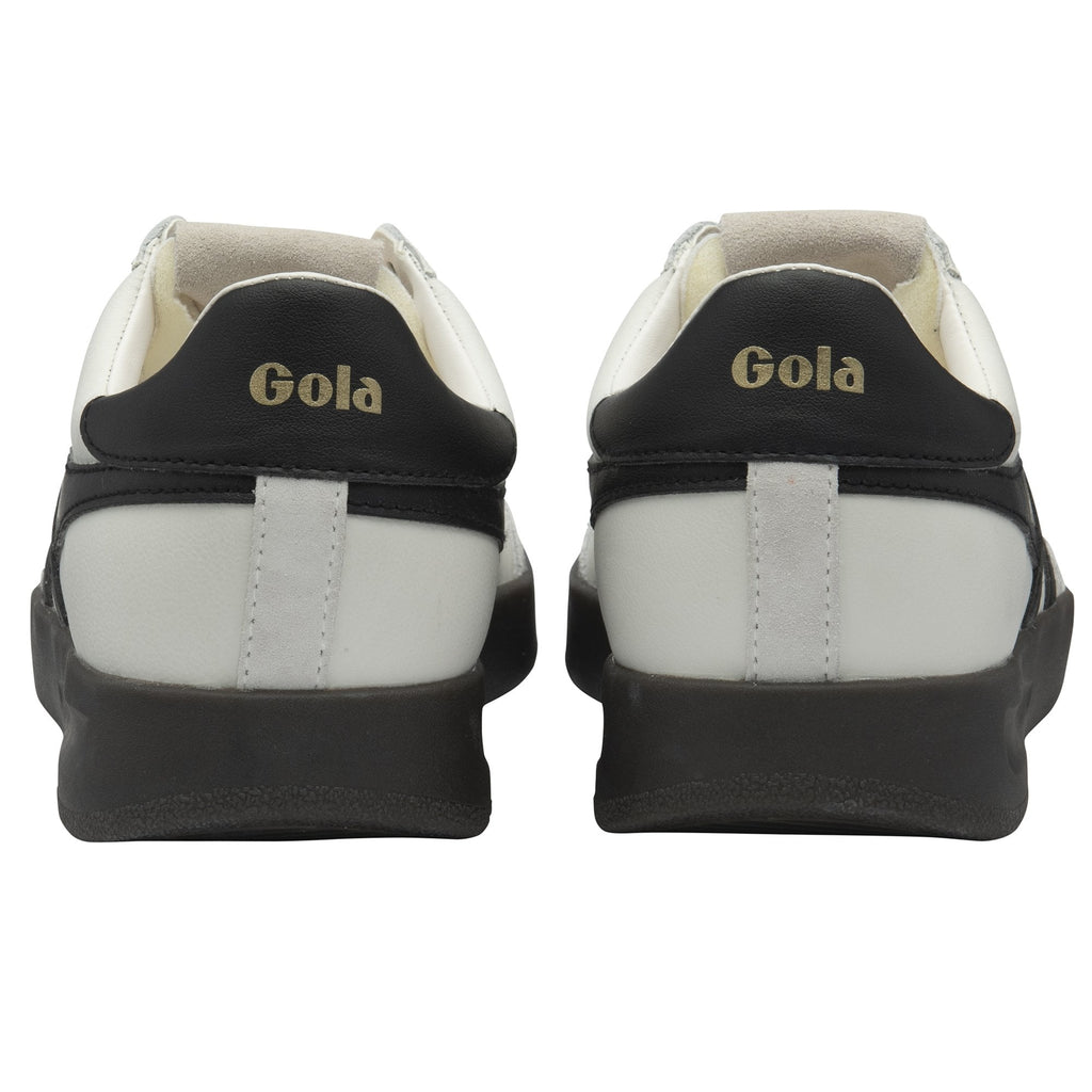 Rear view of a pair of white Gola sneakers with black heels and dark soles.