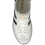 Top down view of a white Gola sneaker with black stripes and white laces.