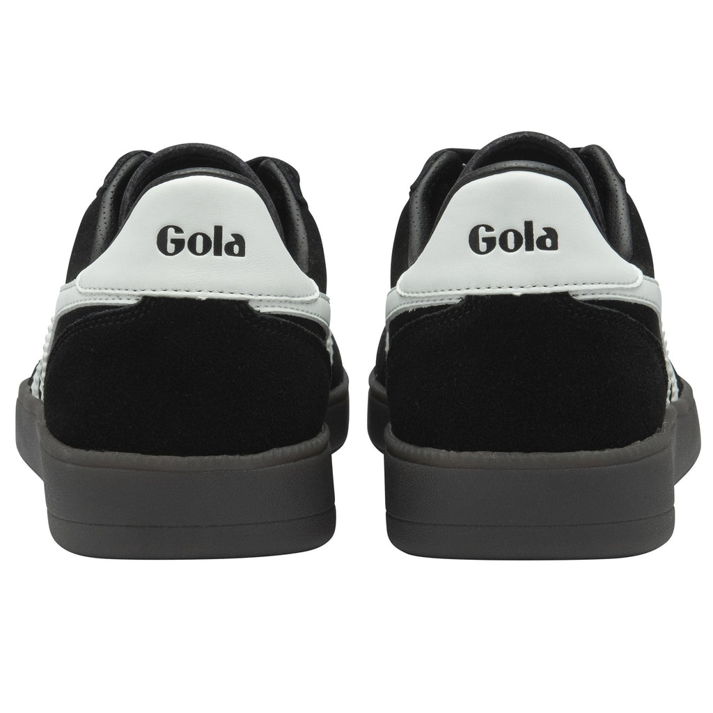 The back view of a pair of black Gola sneakers with white heel accents and a dark gray sole.
