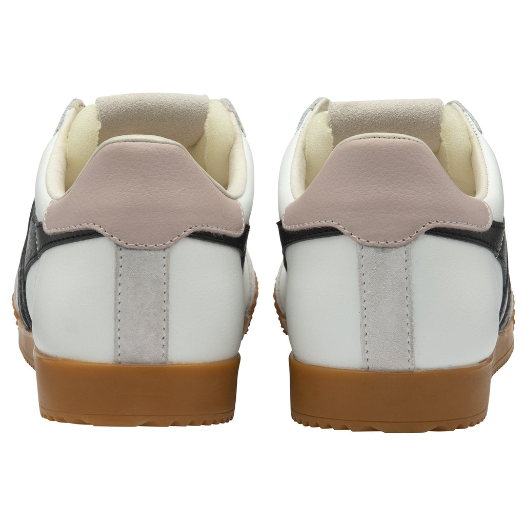 The back view of a pair of white Gola sneakers with black stripes and gum soles.